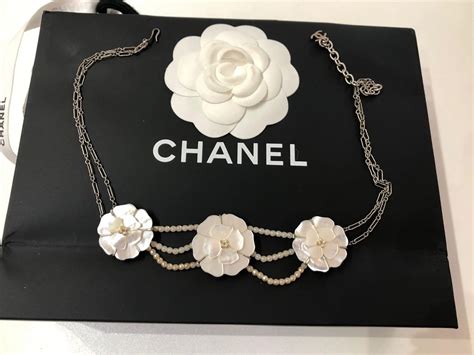 chanel white flowers|Chanel flower necklace.